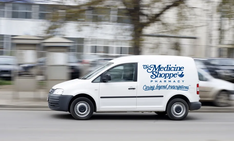 A delivery vehicle with the Medicine Shoppe logo on the side Delivery